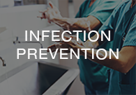 Image: surgeons scrubbing for surgery with the words infectnion prevention, click to access the on-demand infection prevention videos
